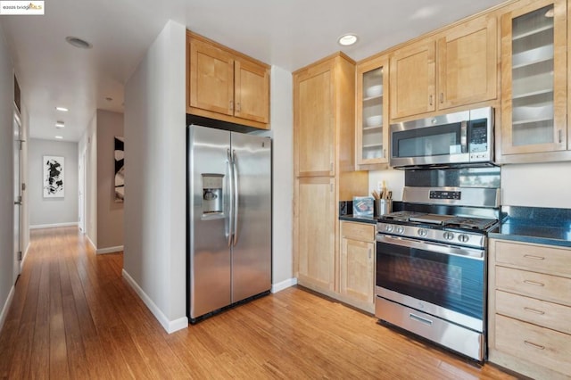 kitchen featuring light hardwood / wood-style flooring, stainless steel appliances, and light brown cabinets