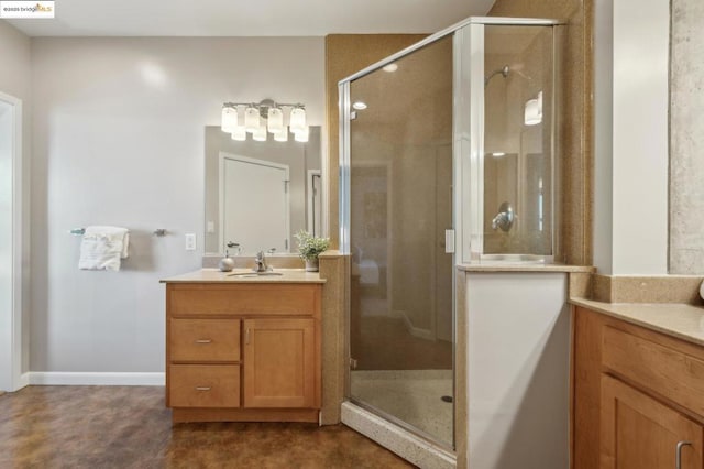 bathroom featuring vanity and an enclosed shower