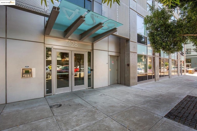 view of exterior entry featuring french doors