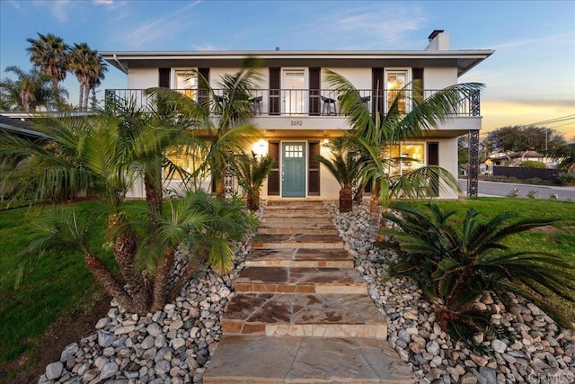 coastal inspired home featuring a balcony