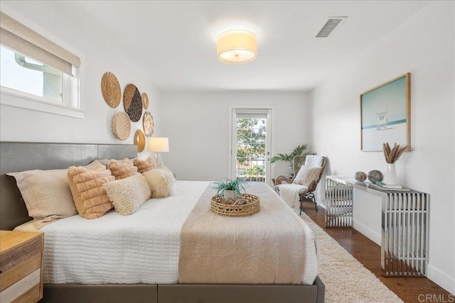 bedroom featuring dark hardwood / wood-style flooring