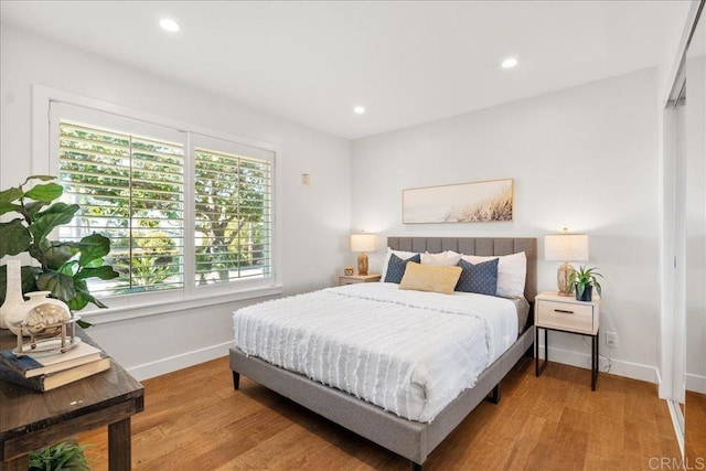 bedroom with light hardwood / wood-style flooring