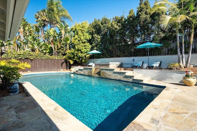 view of swimming pool featuring a patio