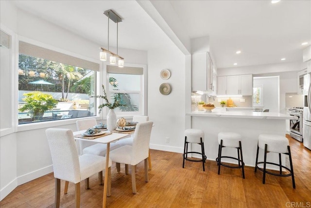 dining space featuring light hardwood / wood-style floors