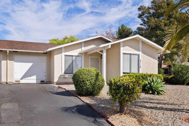 ranch-style home with a garage