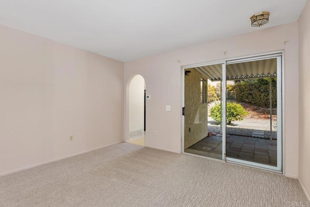 spare room with light colored carpet