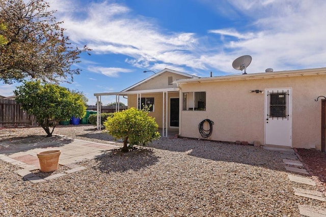 rear view of house featuring a patio area