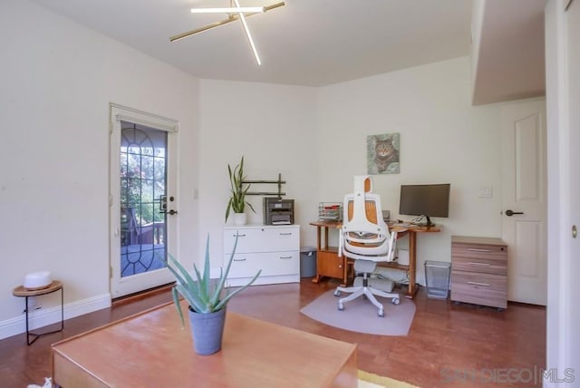 home office with dark hardwood / wood-style floors