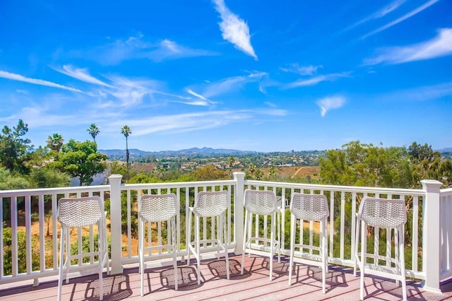 wooden terrace featuring a mountain view