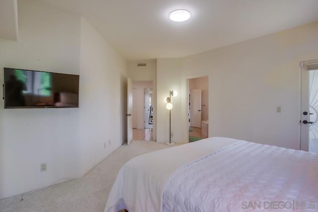 bedroom with light colored carpet