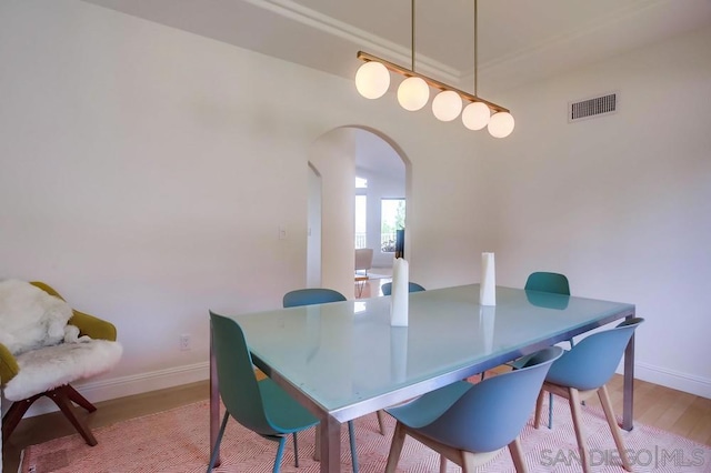 dining space with light hardwood / wood-style flooring