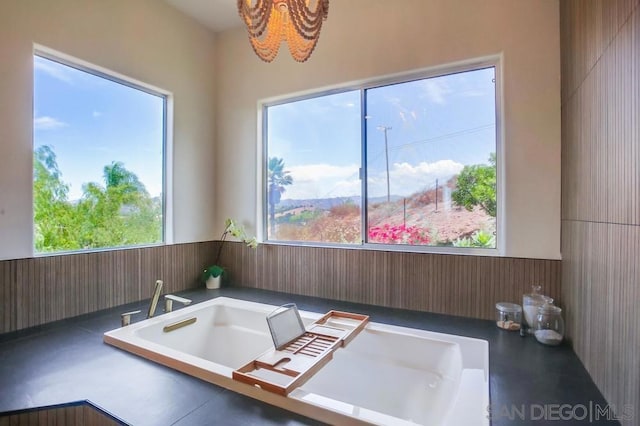 bathroom with wood walls