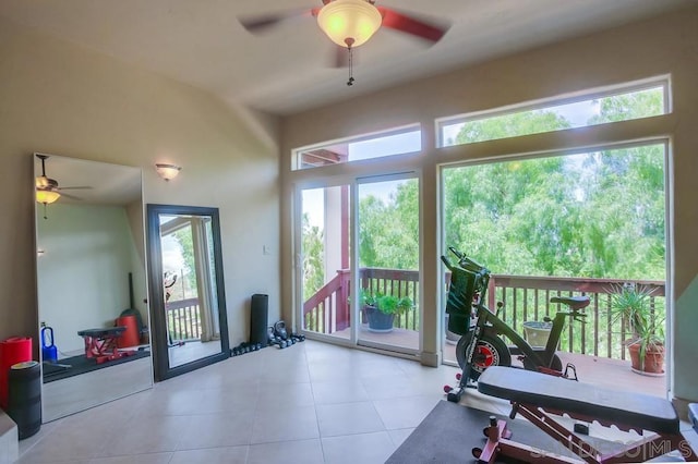 workout room with ceiling fan and light tile patterned floors