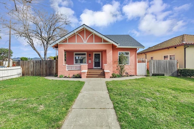 bungalow featuring a front yard and a porch