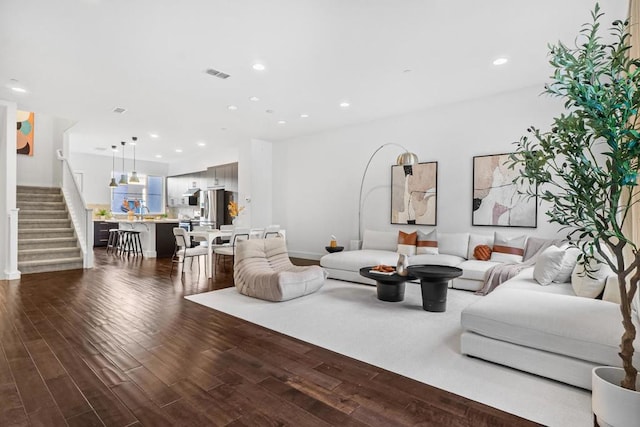 living room with dark hardwood / wood-style floors