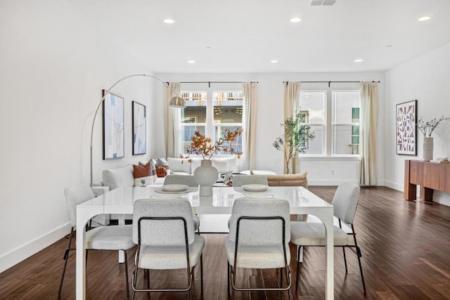 dining space with dark wood-type flooring