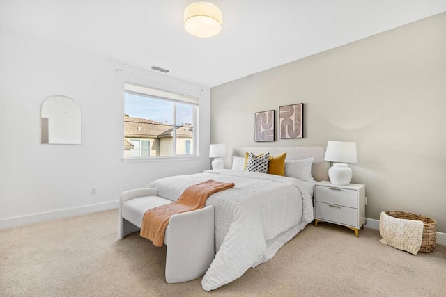 bedroom with light carpet