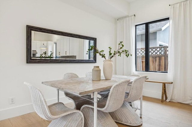 dining space featuring light hardwood / wood-style flooring