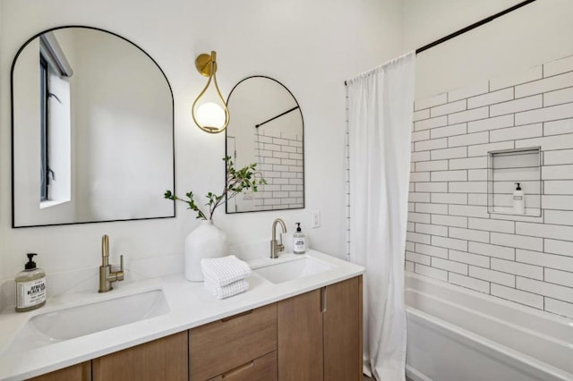 bathroom featuring shower / bathtub combination with curtain and vanity