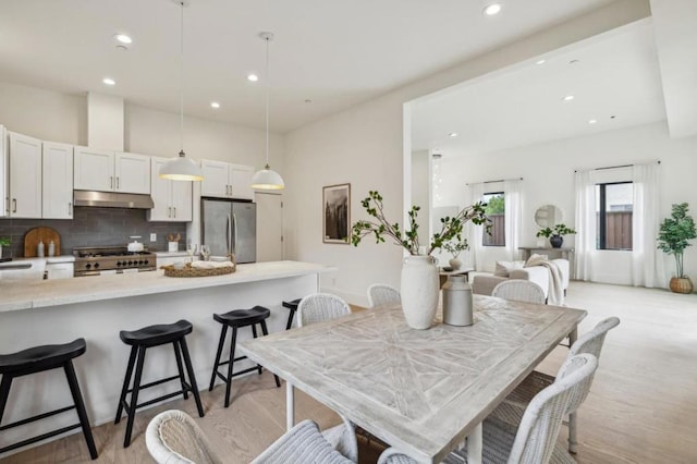 dining area with light hardwood / wood-style flooring