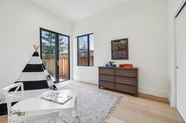 sitting room with light hardwood / wood-style floors