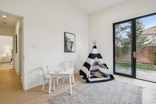 playroom with light wood-type flooring