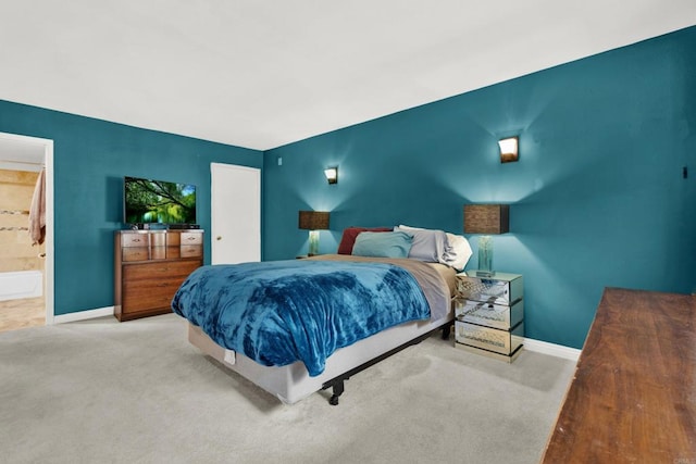 carpeted bedroom with ensuite bathroom