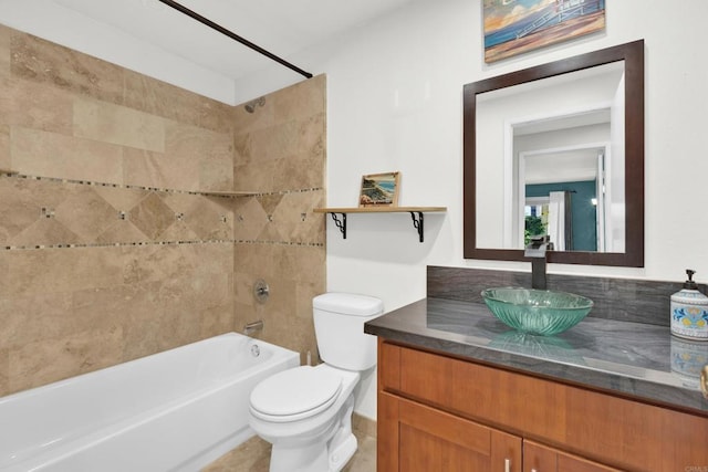 full bathroom with vanity, toilet, and tiled shower / bath combo