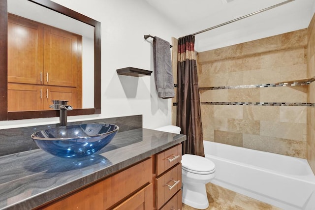 full bathroom with tile patterned floors, toilet, shower / tub combo with curtain, and vanity