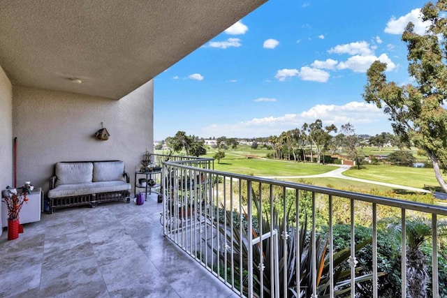 balcony featuring golf course view