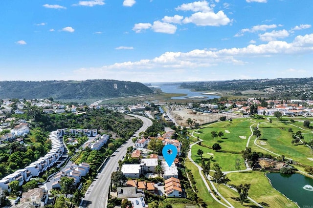 aerial view featuring view of golf course and a water view