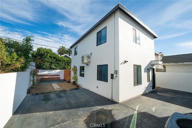 view of side of home featuring a patio