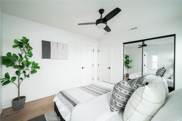 bedroom featuring dark wood-type flooring and ceiling fan