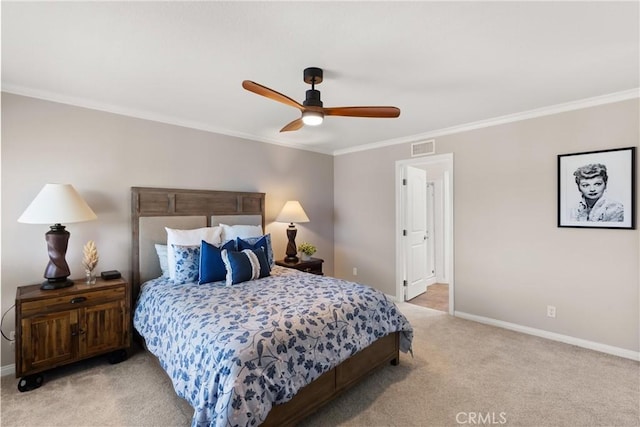 bedroom featuring ornamental molding, light colored carpet, and ceiling fan