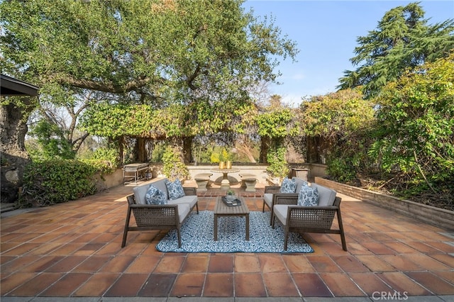 view of patio featuring a grill and an outdoor hangout area