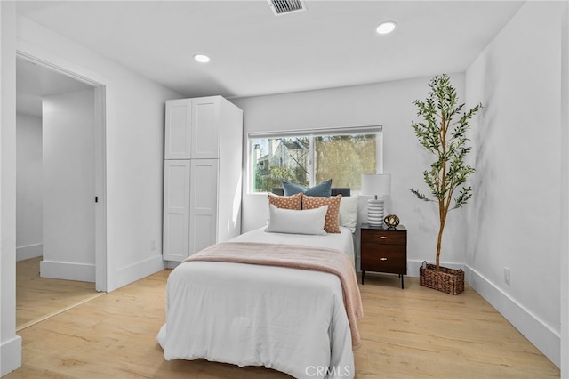 bedroom with light hardwood / wood-style flooring