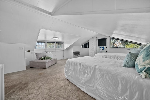 carpeted bedroom featuring lofted ceiling