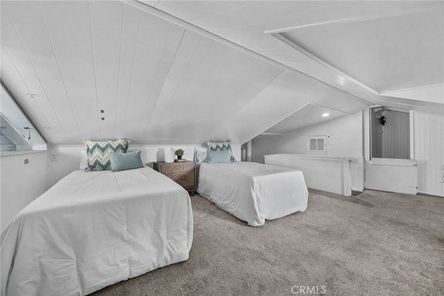 bedroom with carpet flooring and vaulted ceiling