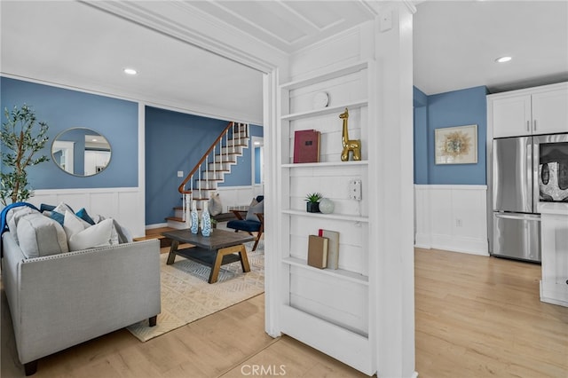 living room featuring light hardwood / wood-style floors and built in features