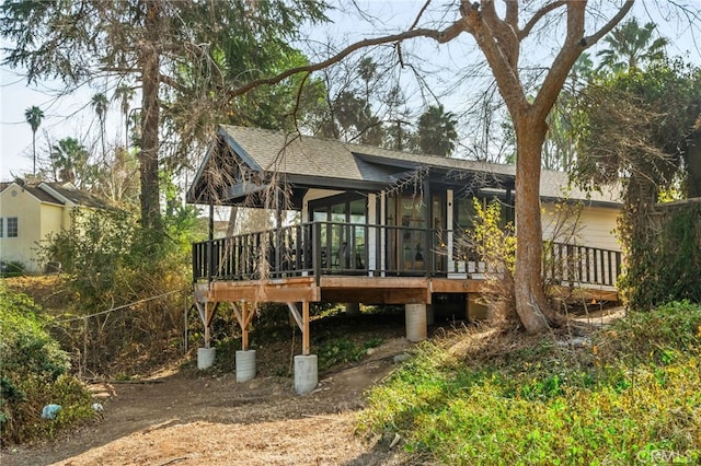 rear view of property with a deck