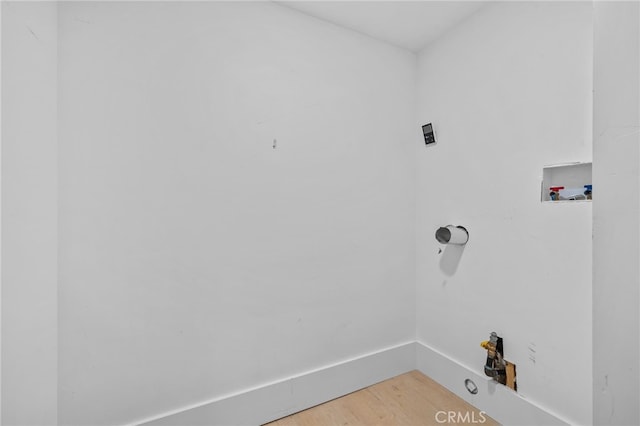 laundry room with washer hookup, wood-type flooring, and gas dryer hookup