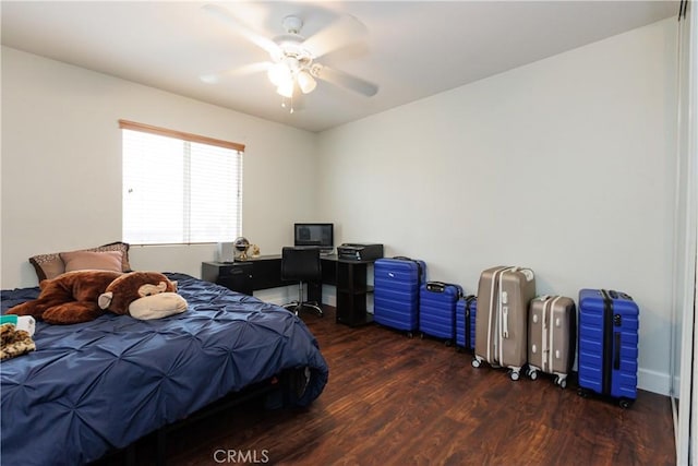 bedroom featuring dark hardwood / wood-style flooring and ceiling fan