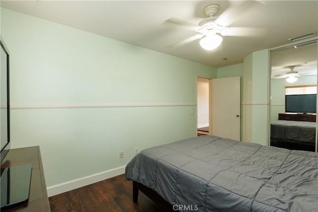 bedroom featuring ceiling fan and dark hardwood / wood-style floors