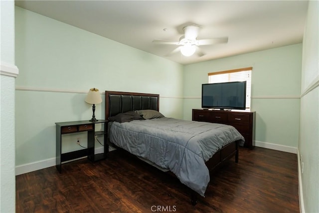 bedroom featuring dark hardwood / wood-style floors and ceiling fan