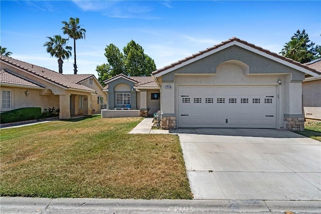 ranch-style home featuring a garage and a front lawn