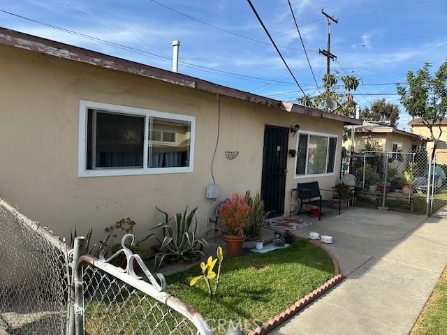 view of front of property with a front lawn and a patio