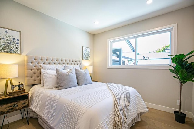 bedroom with light hardwood / wood-style flooring