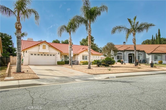 mediterranean / spanish house featuring a garage