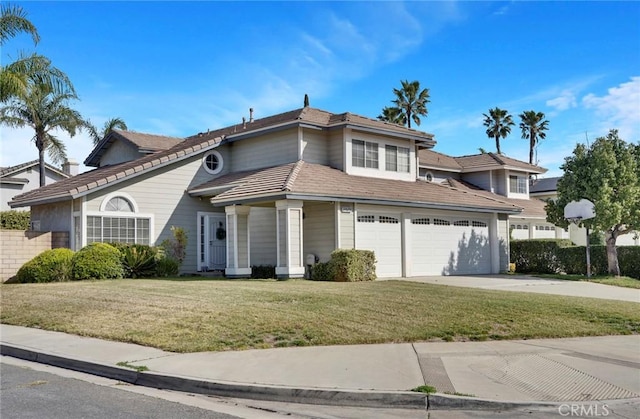 front facade featuring a garage and a front lawn