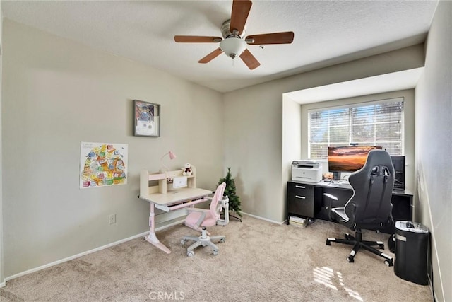 home office with light carpet and ceiling fan